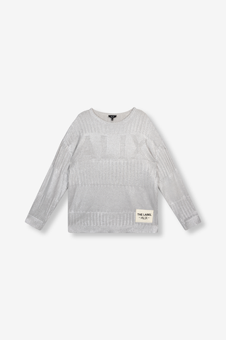 ALIX Foil Pullover champagner mit langen Ärmeln und rundem Halsausschnitt, gestrickt aus weichen Effektgarnen, zeigt ein ALIX-Jacquardmuster auf der Brust und einen ALIX-Aufnäher am Ärmel.