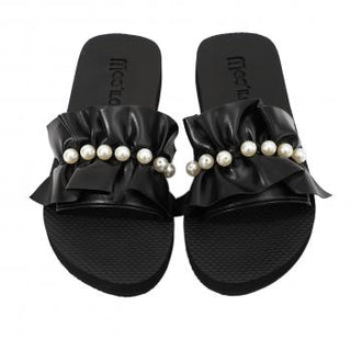 Moo ílo Bandage black Flip Flop mit flexibler, schrittdämpfender Sohle, die ein natürliches Barfußgefühl bietet. Verpackt in einer hochwertigen Neopren-Clutch mit Reißverschluss. Hergestellt aus langlebigem Gummi.