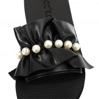 Moo ílo Bandage black Flip Flop mit ultraweicher, schrittdämpfender Innensohle und fester Untersohle für maximalen Komfort. Verpackt in erstklassiger Neopren-Clutch. Limitierte Auflage für ein natürliches Barfußgefühl.