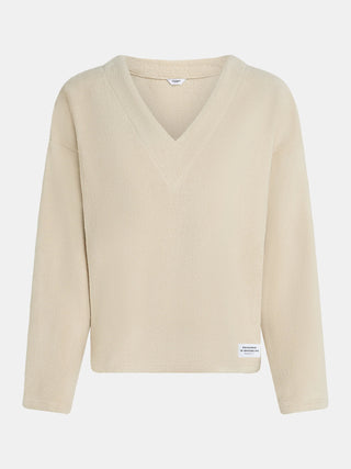 Penn&Ink Pulli naturel: Frauenpullover aus weichem, flauschigem Stoff in Beige, mit langen Ärmeln und V-Ausschnitt. Kleines Etikett Designed in Brooklyn nahe dem Saum.