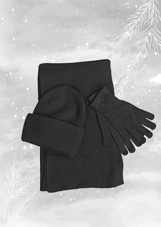 OFF#DLY Mütze/Schal/Handschuhe Set black: Drei schwarze Strickteile, bestehend aus einem Schal, einer Mütze mit umgeschlagenem Rand und Fingerhandschuhen, auf grauem Hintergrund mit Schneemotiv.