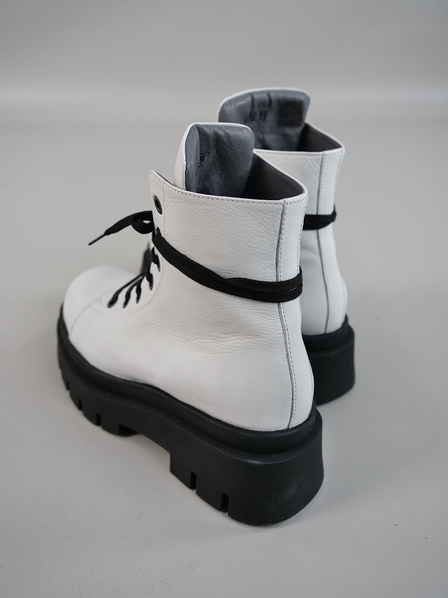 White boots with black sole hotsell